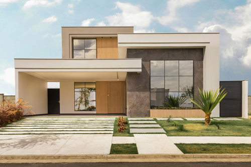 A modoern black, white and light wood coloured house with a palm tree and a driveway that is split into sections with grass details.